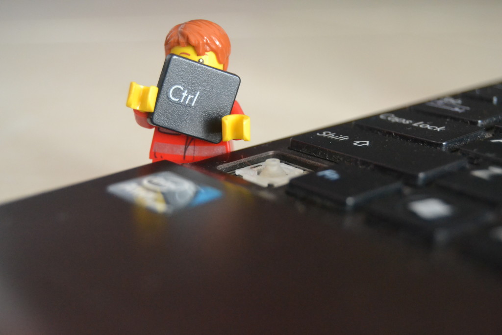 Lego character holding CTRL key from keyboard